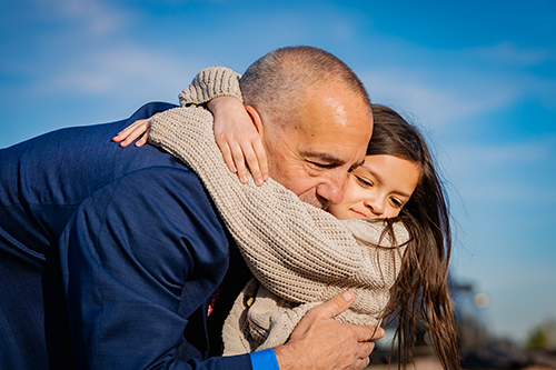 James Boelens hugging child