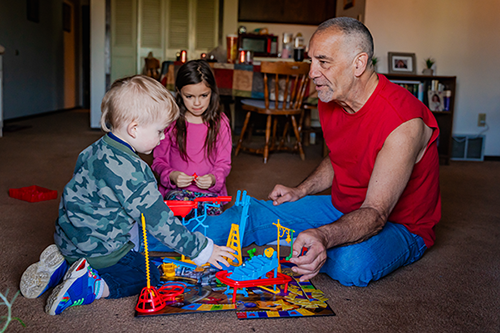 James Boelens playing with kids
