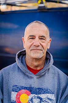 James Boelens in front of work van