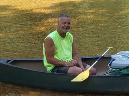 James Boelens sitting in canoe