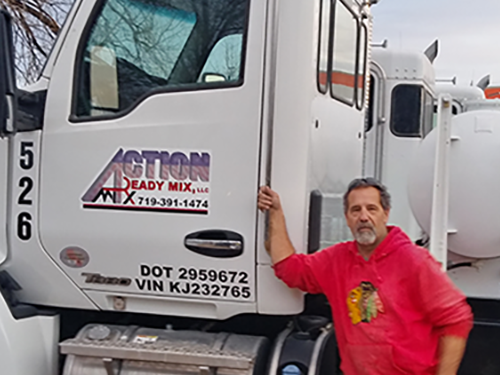 James Boelens standing in front of cement truck